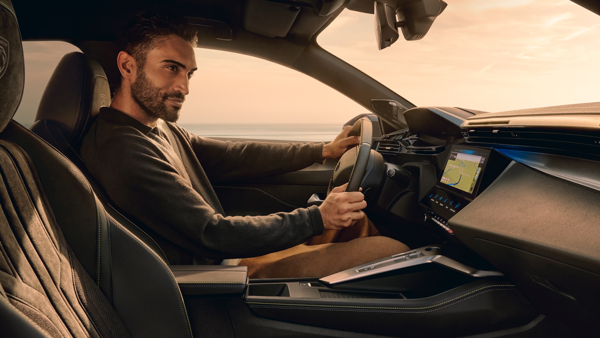 Man driving a Peugeot